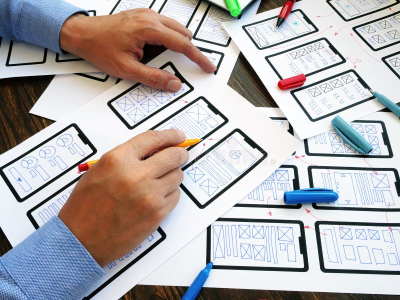The UX designer develops web mobile application. stock photo