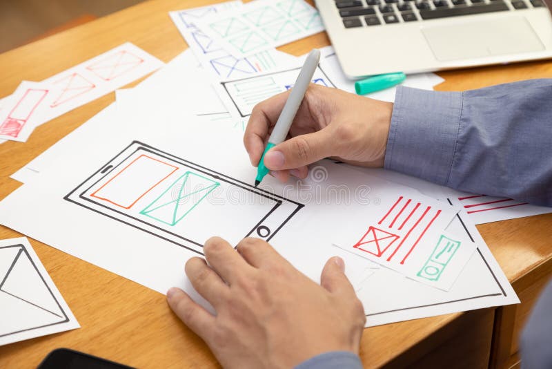 UX Graphic designer creative sketch and planning prototype wireframe for web mobile phone. Application development and user experience concept royalty free stock photography UX Graphic designer creative sketch and planning prototype wireframe for web mobile phone. Application development and user experience concept royalty free stock photography