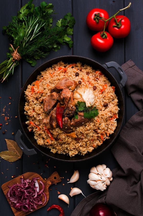 https://thumbs.dreamstime.com/b/uzbek-pilaf-stewed-rice-meat-cast-iron-cauldron-dark-gray-wooden-table-top-view-no-people-toned-uzbek-pilaf-stewed-242892040.jpg