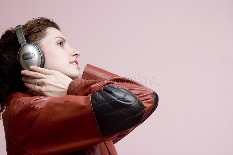 Side view of a girl listening to music. Side view of a girl listening to music