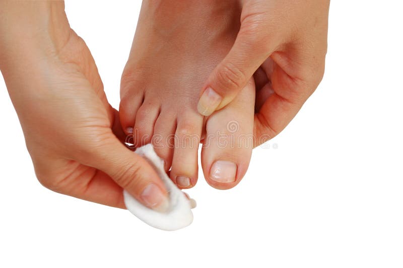 Young woman cleaning toenails, close-up isolated over white background. Young woman cleaning toenails, close-up isolated over white background