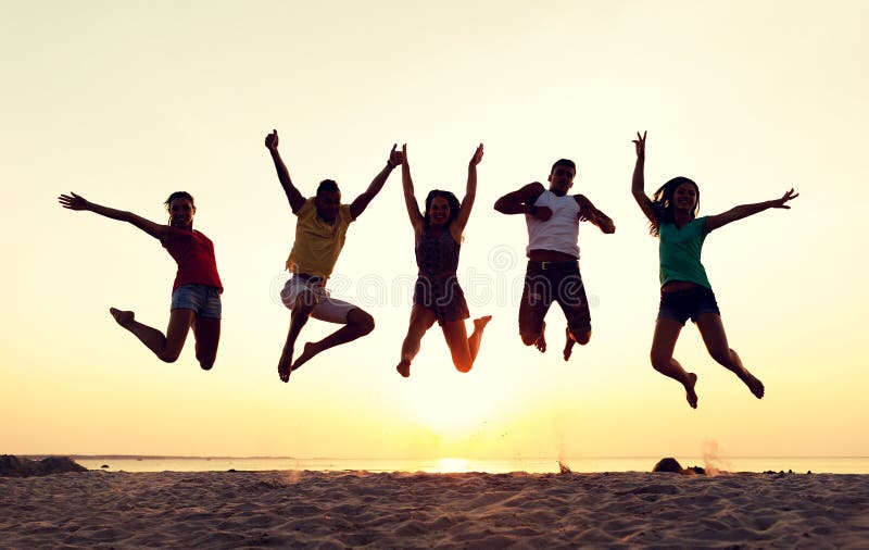 Friendship, summer vacation, holidays, party and people concept - group of smiling friends dancing and jumping on beach. Friendship, summer vacation, holidays, party and people concept - group of smiling friends dancing and jumping on beach