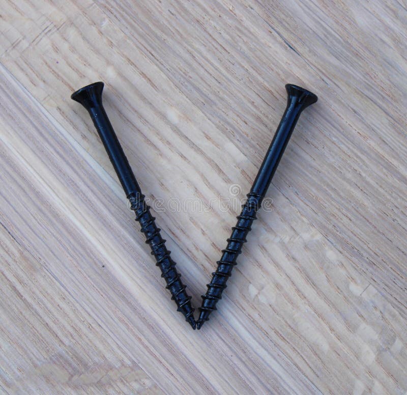 A V Shape Made from Two Black Construction Screws Stock Image Image