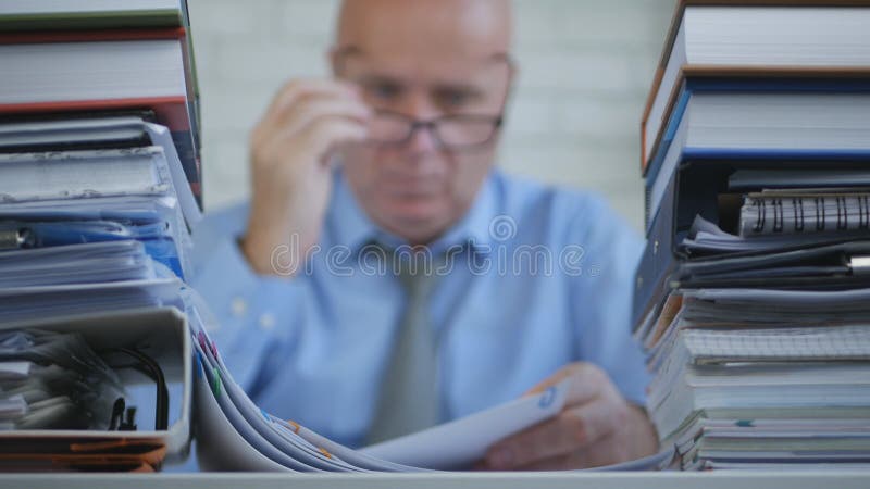 Blurred Image with a Businessperson In Accounting Archive Working With Documents. Blurred Image with a Businessperson In Accounting Archive Working With Documents