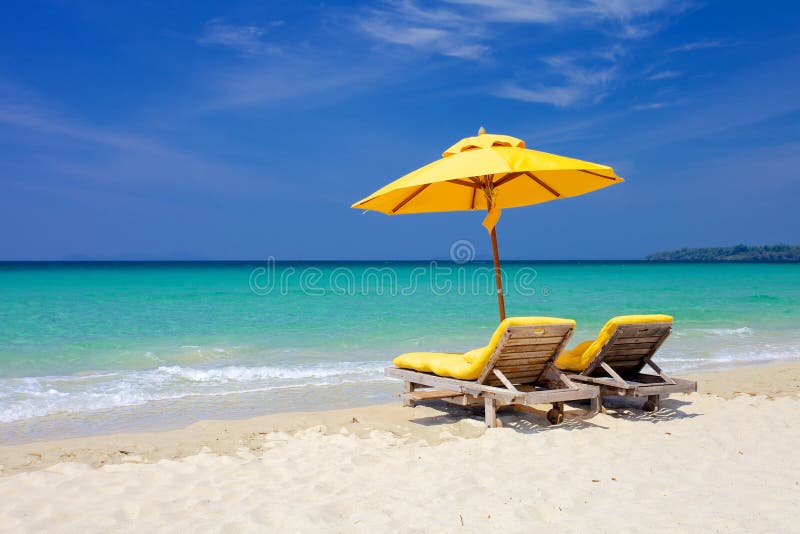 Sunbeds in a tropical beach. Sunbeds in a tropical beach