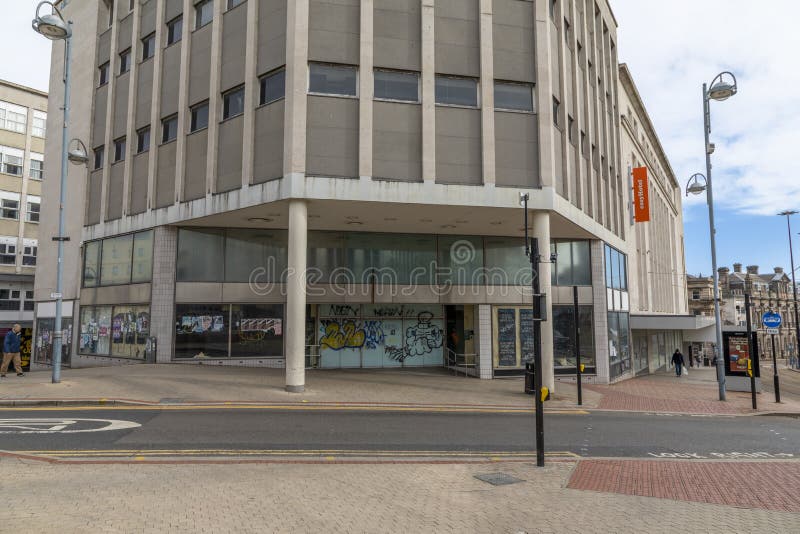 Vacant Retail Building with for Sale Real Estate Sign Stock Image