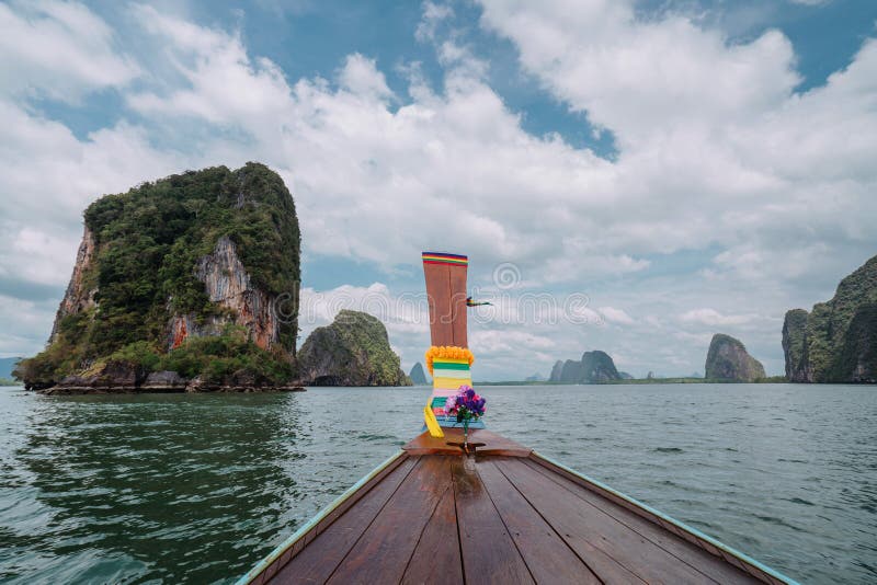 Vacation in sunny Asia. View from the deck National Thai Longtail boat. Excursion between the islands of Pang Nga Bay