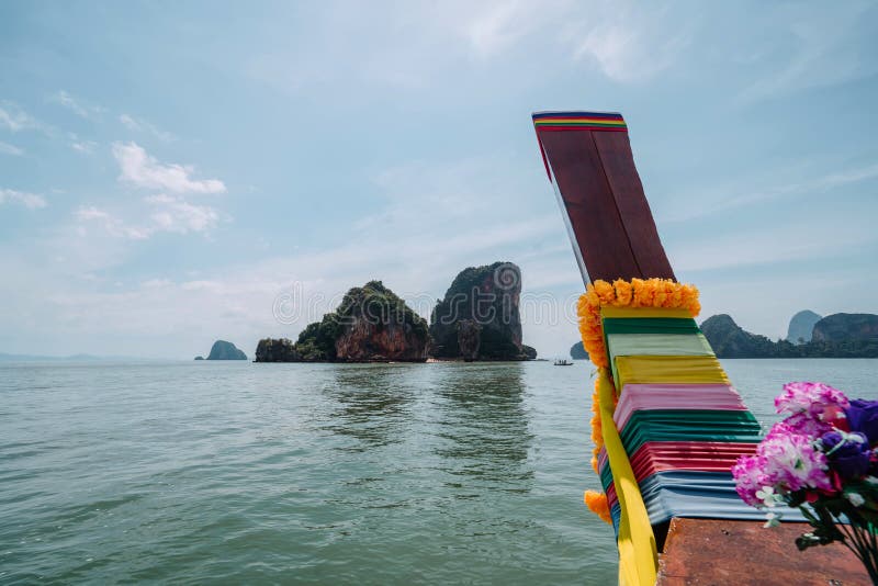 Vacation in sunny Asia. View from the deck National Thai Longtail boat. Excursion between the islands of Pang Nga Bay