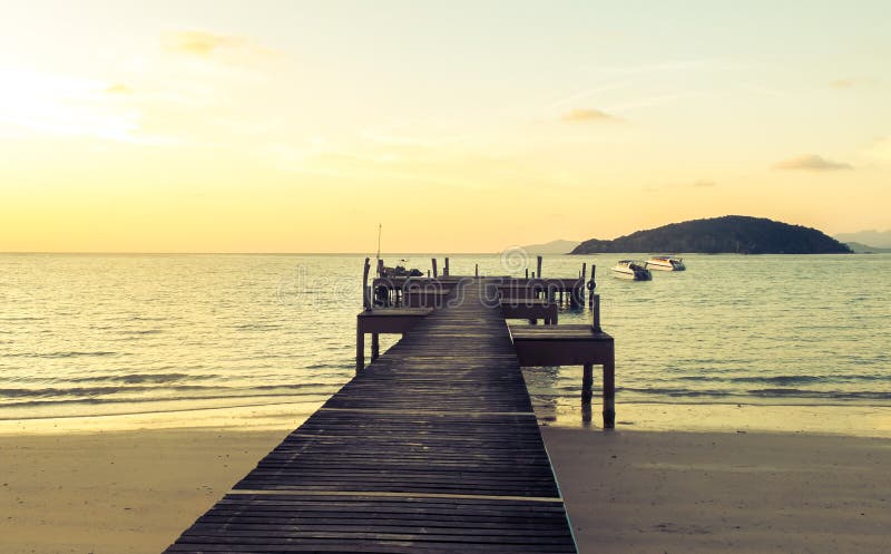 Vacation Time Concept, Soft Focus Color Filter Wooden Path Between Crystal Clear Blue Sea and Sky royalty free stock photos Vacation Time Concept, Soft Focus Color Filter Wooden Path Between Crystal Clear Blue Sea and Sky royalty free stock photos