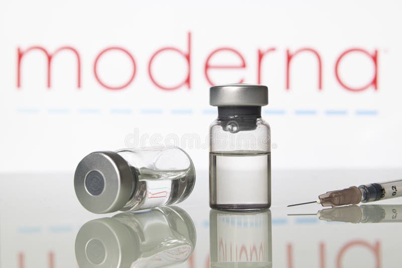 Milan, Italy: November 14, 2020: Vaccine vials and syringe with Moderna Inc logo. Big Pharma companies are racing to complete clinical trials to get the approval for a vaccine to fight the coronavirus Covid-19 virus