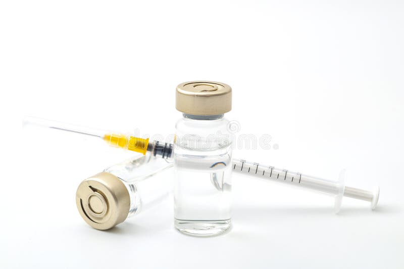 Vaccines, botulinum toxin and insulin ampules concept theme with glass vials with clear liquid next to a syringe and a hypodermic