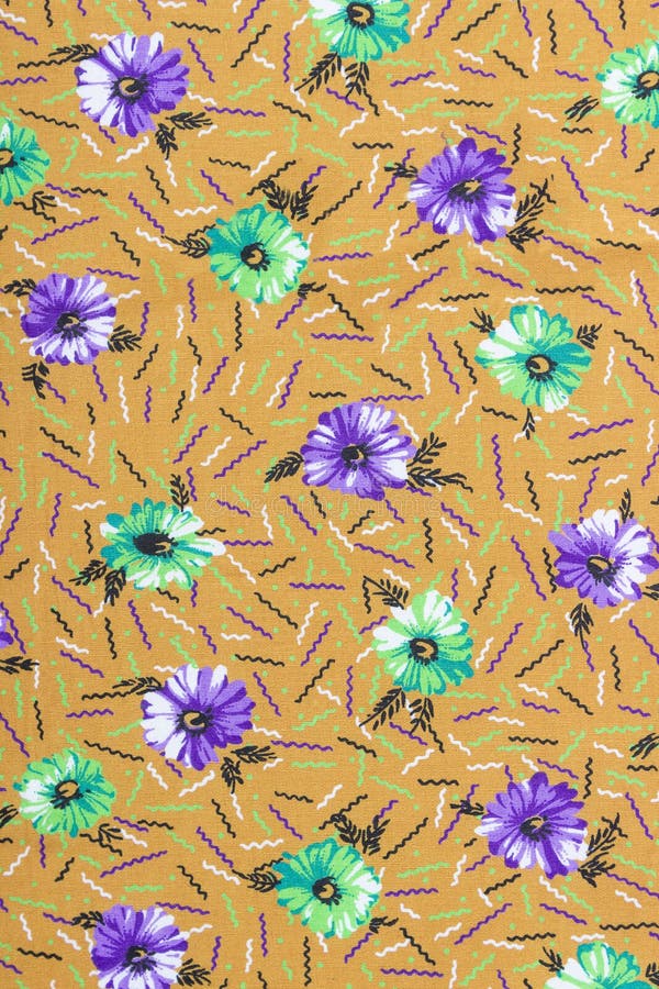 Vacker kalicotextur med broderade blommor i en lugn, ren bakgrund arkivfoton