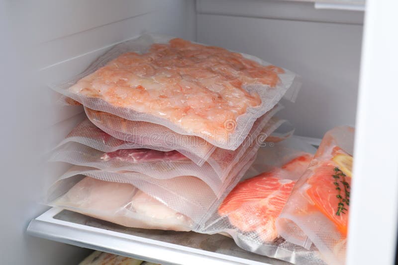 Vacuum Bags with Different Products in Fridge. Food Storage Stock Image