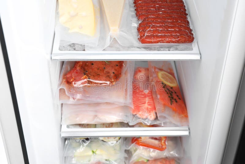 Vacuum Bags with Different Products in Fridge. Food Storage Stock Image
