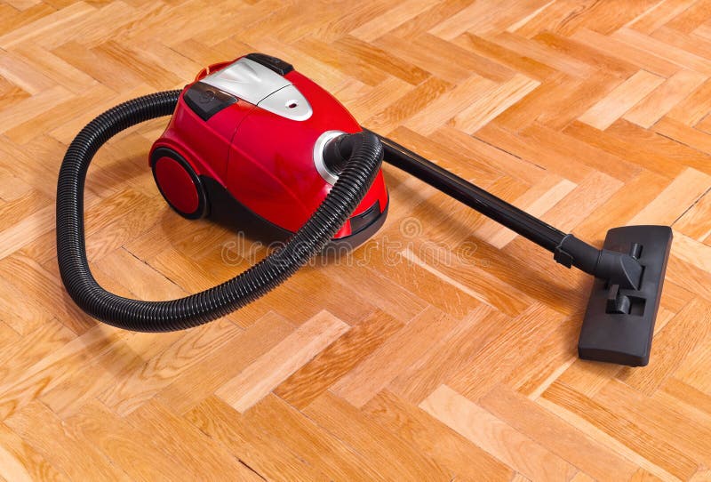 Vacuum cleaner on parquet stock image. Image of housework 49329697