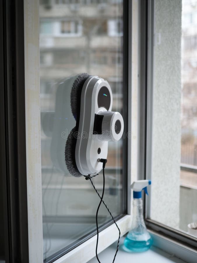 Vacuum Cleaner Robot Cleaning Window in High Building Outdoor Stock