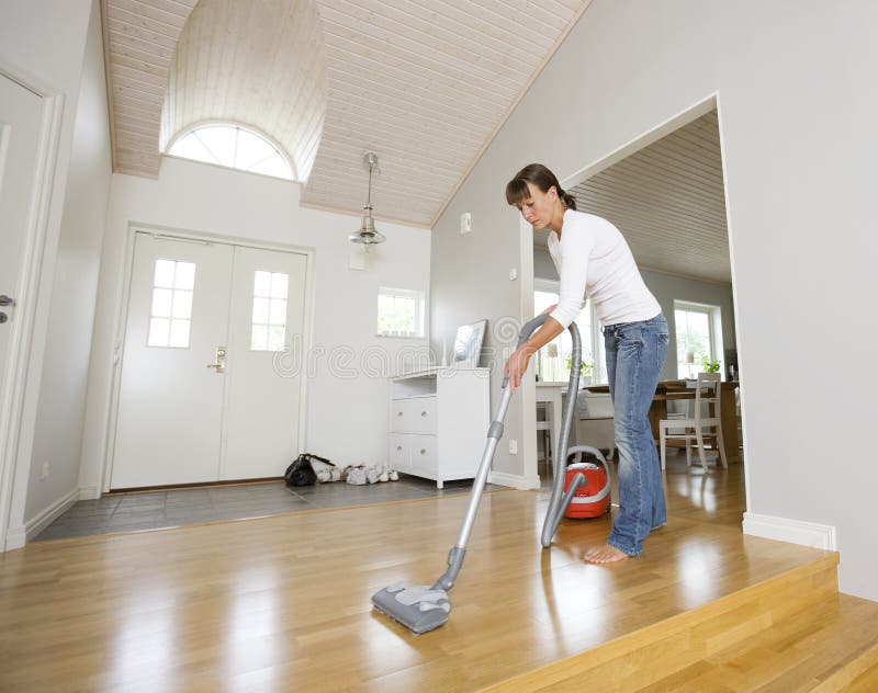 Man using a vacuum cleaner stock photo. Image of people 22365900