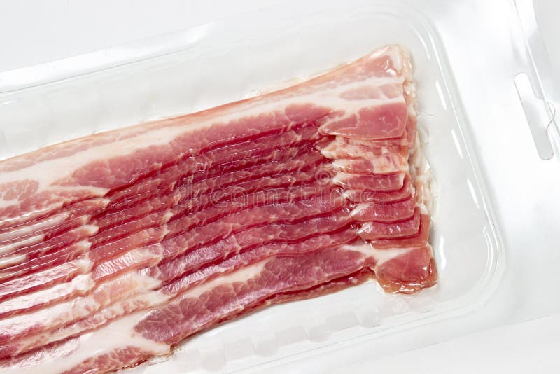 Vacuumpacked Bacon on a White Background. a Modern Way of Storing and