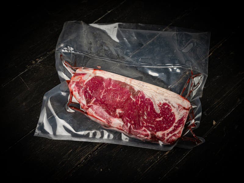 Vacuumpacked Raw Ribeye Beef Steak. Stock Photo Image of dark
