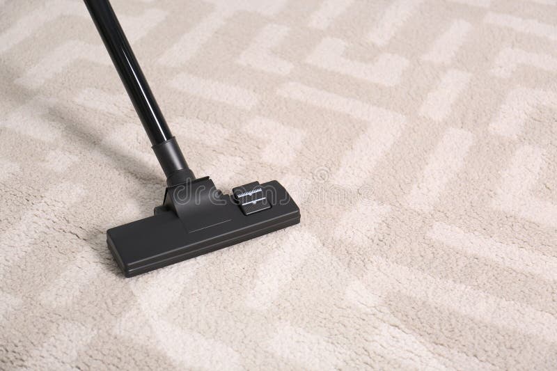Vacuuming Dirty Beige Carpet. Clean Area after Using Device, Top View