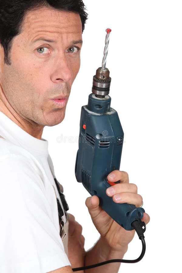 Vakman die een boor houdt stock foto Vakman die een boor houdt stock foto