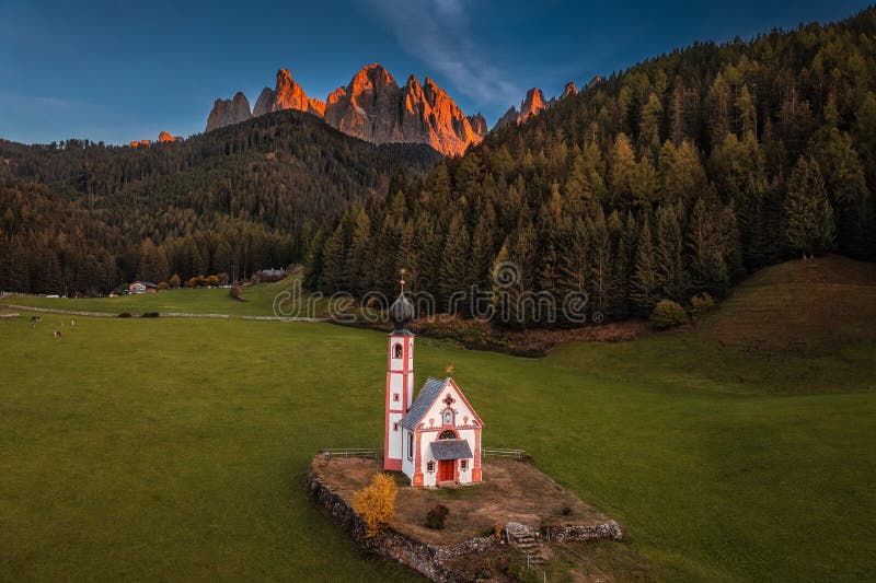 Val Di Funes, Dolomites, Italy - Aerial view of beautiful St. Johann Church Chiesetta di San Giovanni in Ranui at South Tyrol