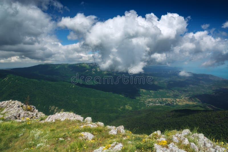 Crimea valley with white clouds over the mountains. Summer landscape. Crimea valley with white clouds over the mountains. Summer landscape