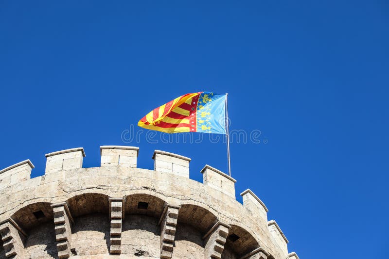 Valencia flag waving on top of city tower