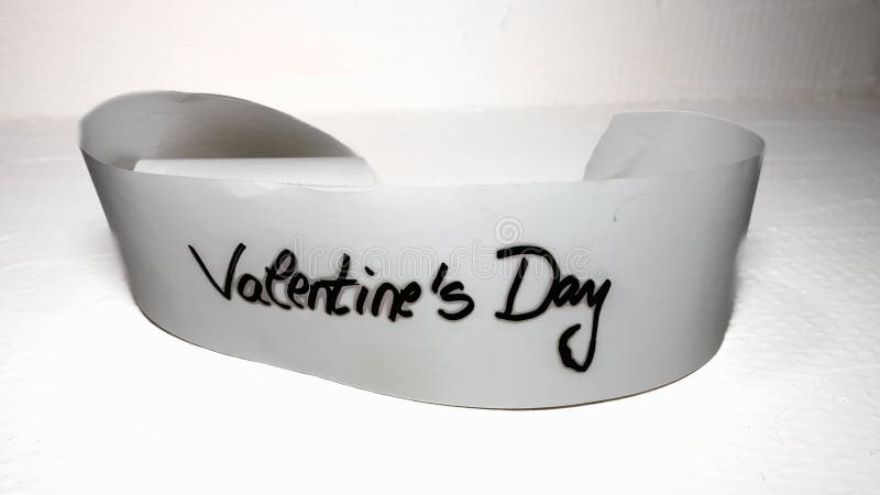 Handwriting text Valentine`s day.  Label tag with lovely message. Romantic love concept for Valentine`s day. Handwriting text Valentine`s day.  Label tag with lovely message. Romantic love concept for Valentine`s day