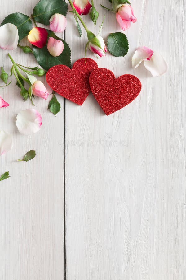 Valentine day background, hearts and flowers on white wood