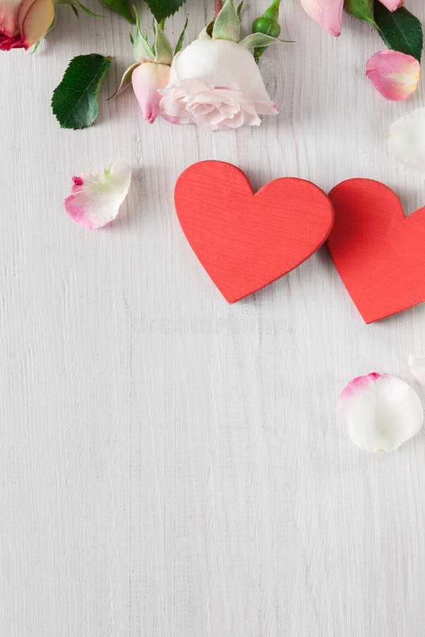 Valentine day background, hearts and flowers on white wood