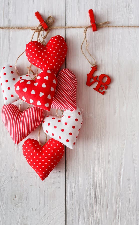 Valentine day background, pillow hearts bunch on wood, copy space