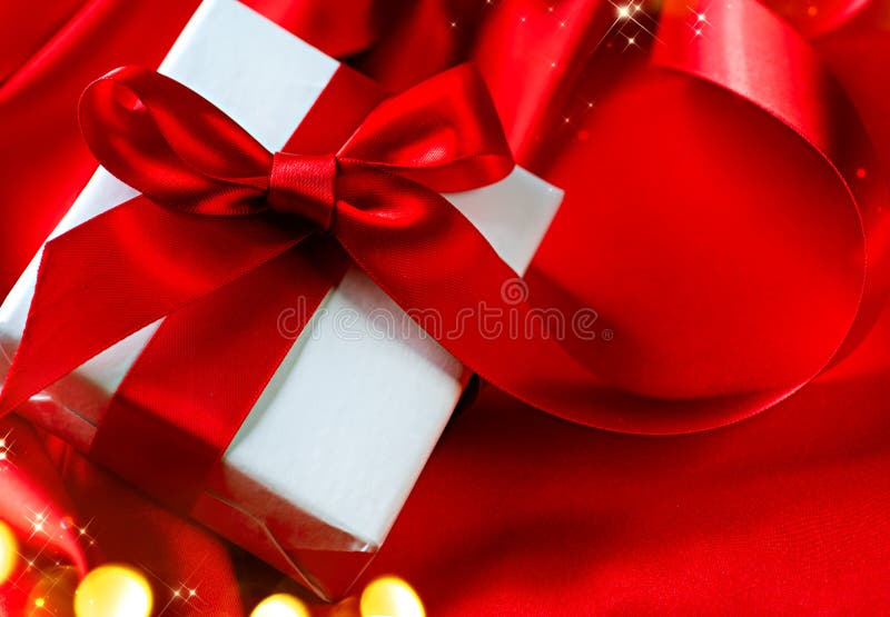 Valentine gift box on red silk background