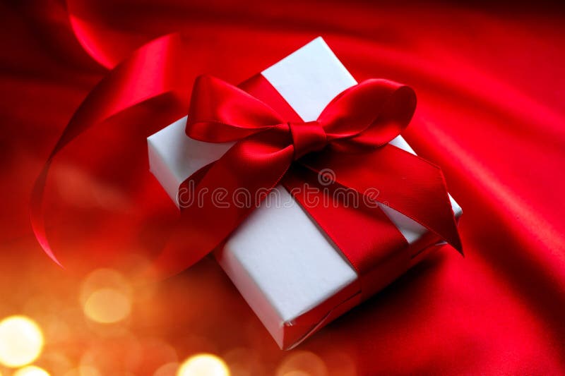 Valentine gift box on red silk background