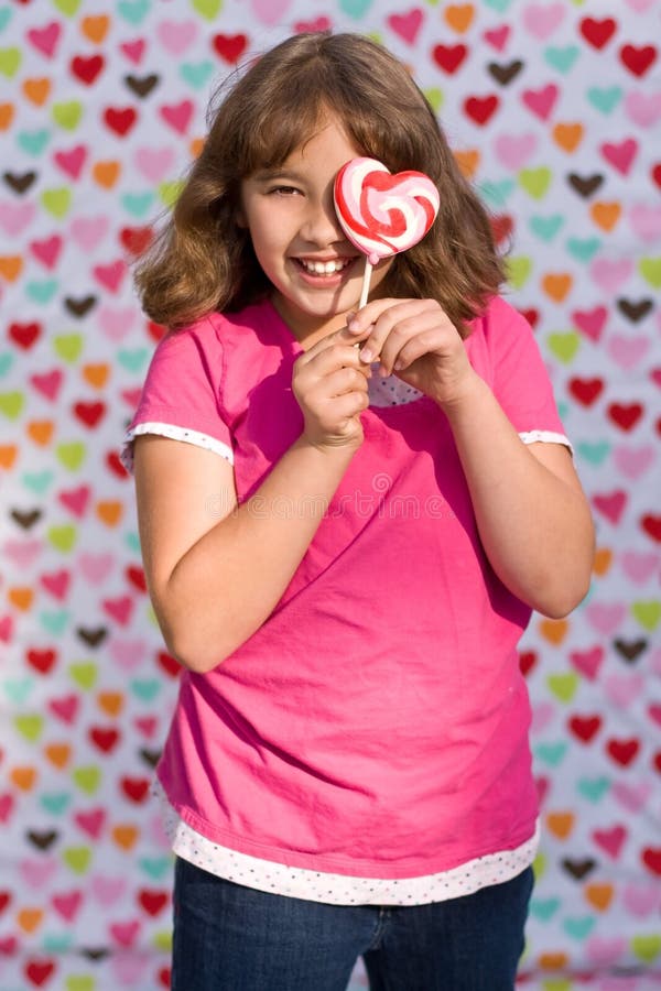 Valentine girl with lollipop