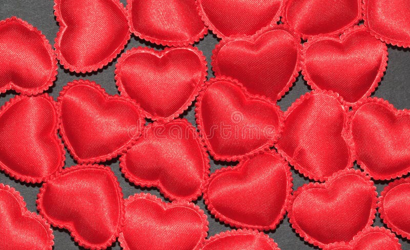 Valentine hearts on grey background as symbol of love and care