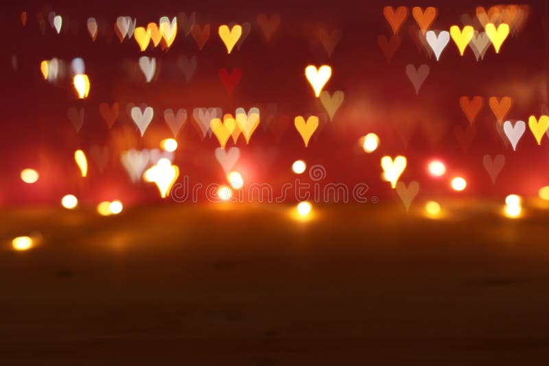 Valentine' s-dagromantiker blänker bokehbakgrund med många hjärtaljus royaltyfri bild Valentine' s-dagromantiker blänker bokehbakgrund med många hjärtaljus royaltyfri bild