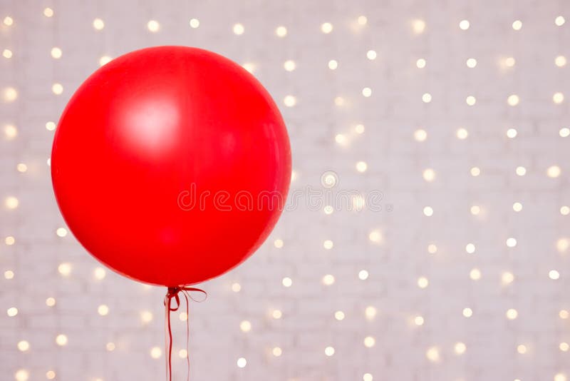 Valentine`s day background - big red balloon and copy space over white brick wall