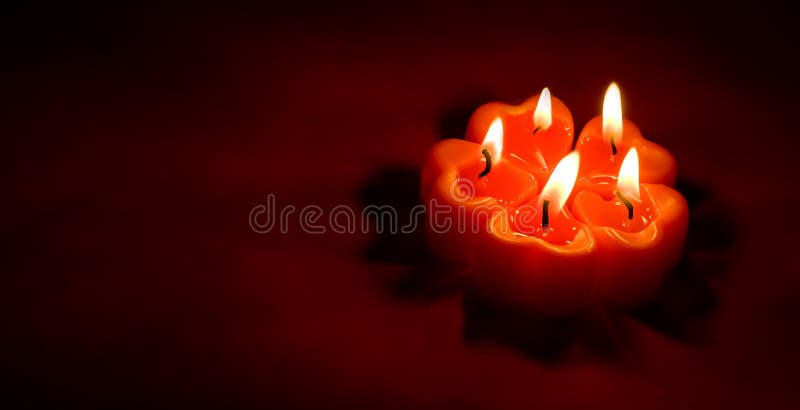 Valentine&#x27;s Day. banner with heart shaped red burning candles in the dark