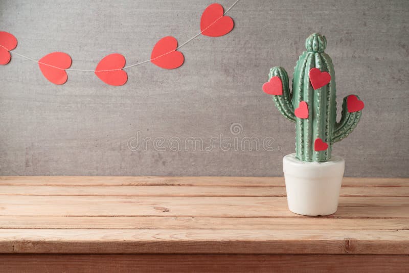 Valentine`s day concept with decor cactus and heart shapes over garland background royalty free stock photos Valentine`s day concept with decor cactus and heart shapes over garland background royalty free stock photos
