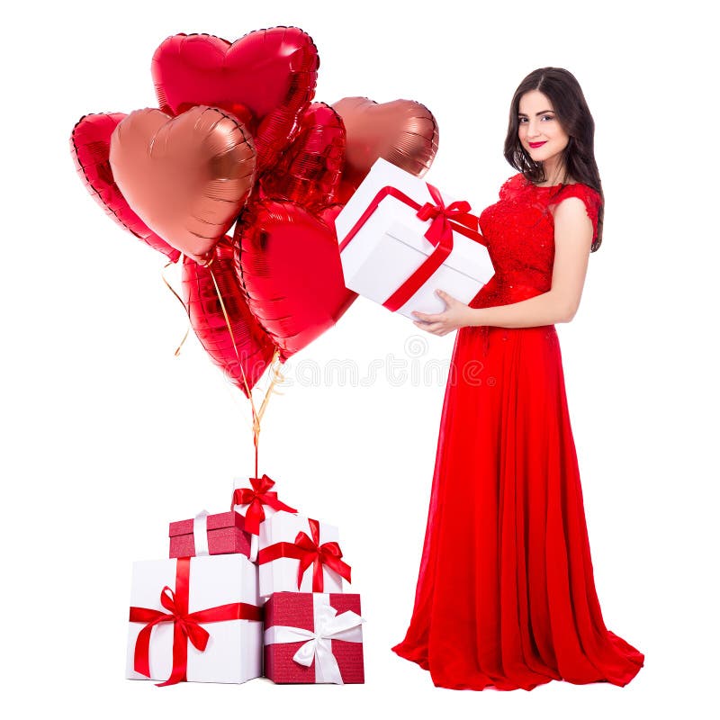 Valentine`s day concept - full length portrait of cheerful woman in red dress with gift boxes and air balloons isolated on white stock image Valentine`s day concept - full length portrait of cheerful woman in red dress with gift boxes and air balloons isolated on white stock image