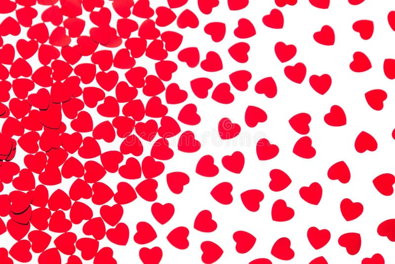 Valentine`s day decorative pattern red hearts confetti isolated on white background. stock photo