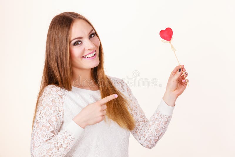 Beautiful woman holding heart shaped hand stick stock photo Beautiful woman holding heart shaped hand stick stock photo