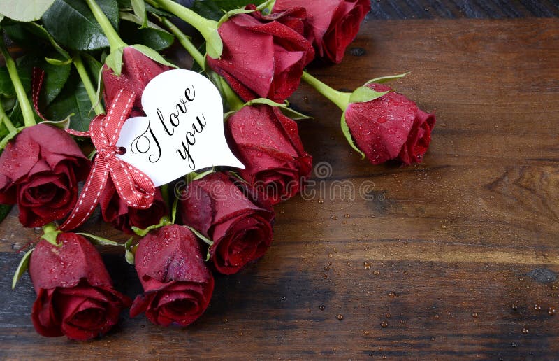 Valentine s Day red roses on dark recycled wood background