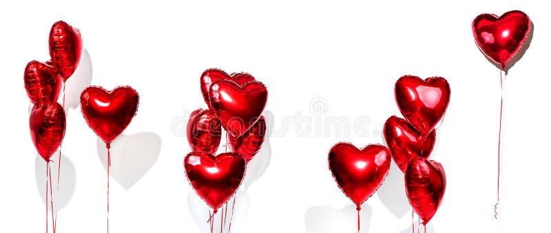 Valentine`s Day. Set of air balloons. Bunch of red heart shaped foil balloons isolated on white