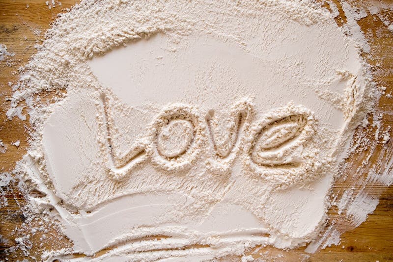 Valentine S Day. the Word LOVE is Written in Flour, on a Wood Texture ...