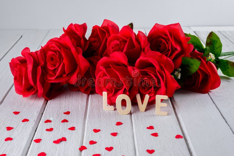 Valentines background with red rose, Heart shape, Wooden letters word