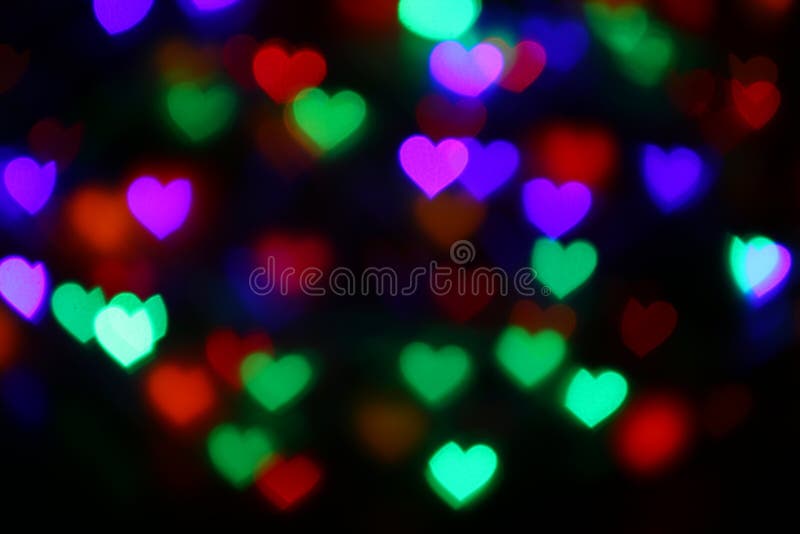 Valentines Colorful heart-shaped bokeh on black background lighting bokeh for decoration at night wallpaper blur valentine