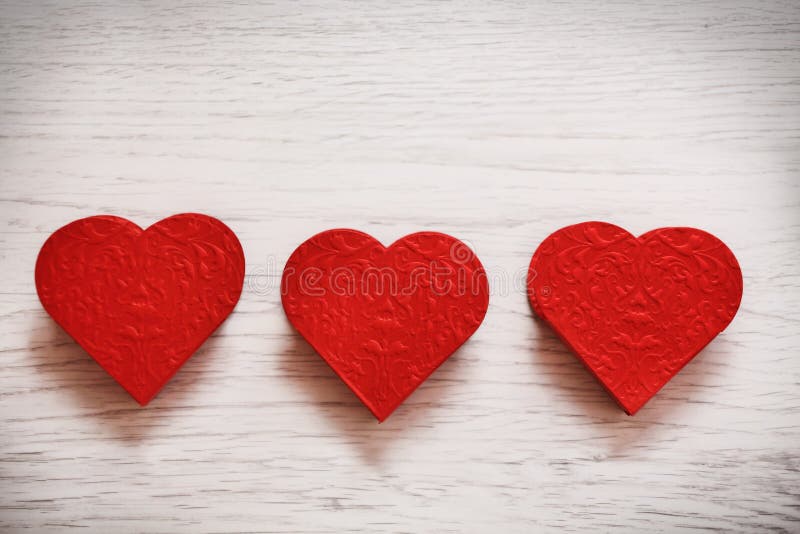 Valentines day background with three hearts