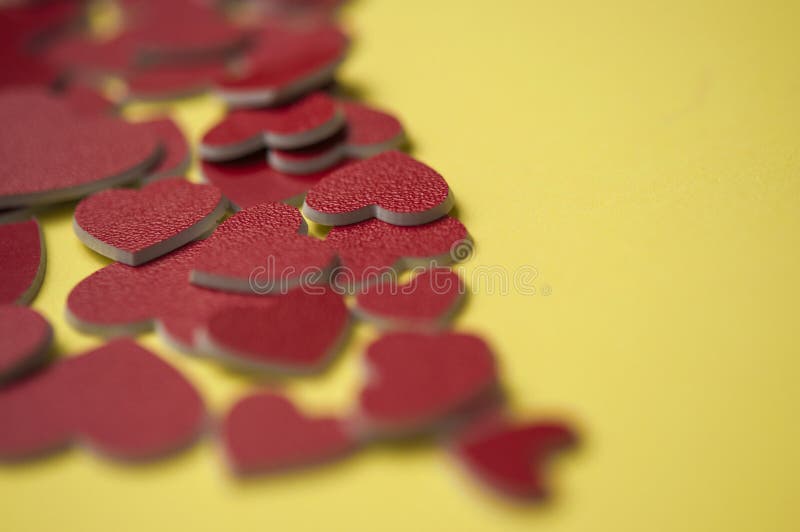 Valentines day concept. Red hearts on yellow paper background Greeting card concept. Top view royalty free stock photo Valentines day concept. Red hearts on yellow paper background Greeting card concept. Top view royalty free stock photo